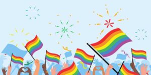 Raised arms of diverse cultures waiving rainbow pride flags with fireworks bursting on a pale blue background.